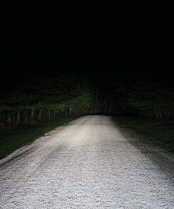 Open dirt road with awesome headlights lighting the way